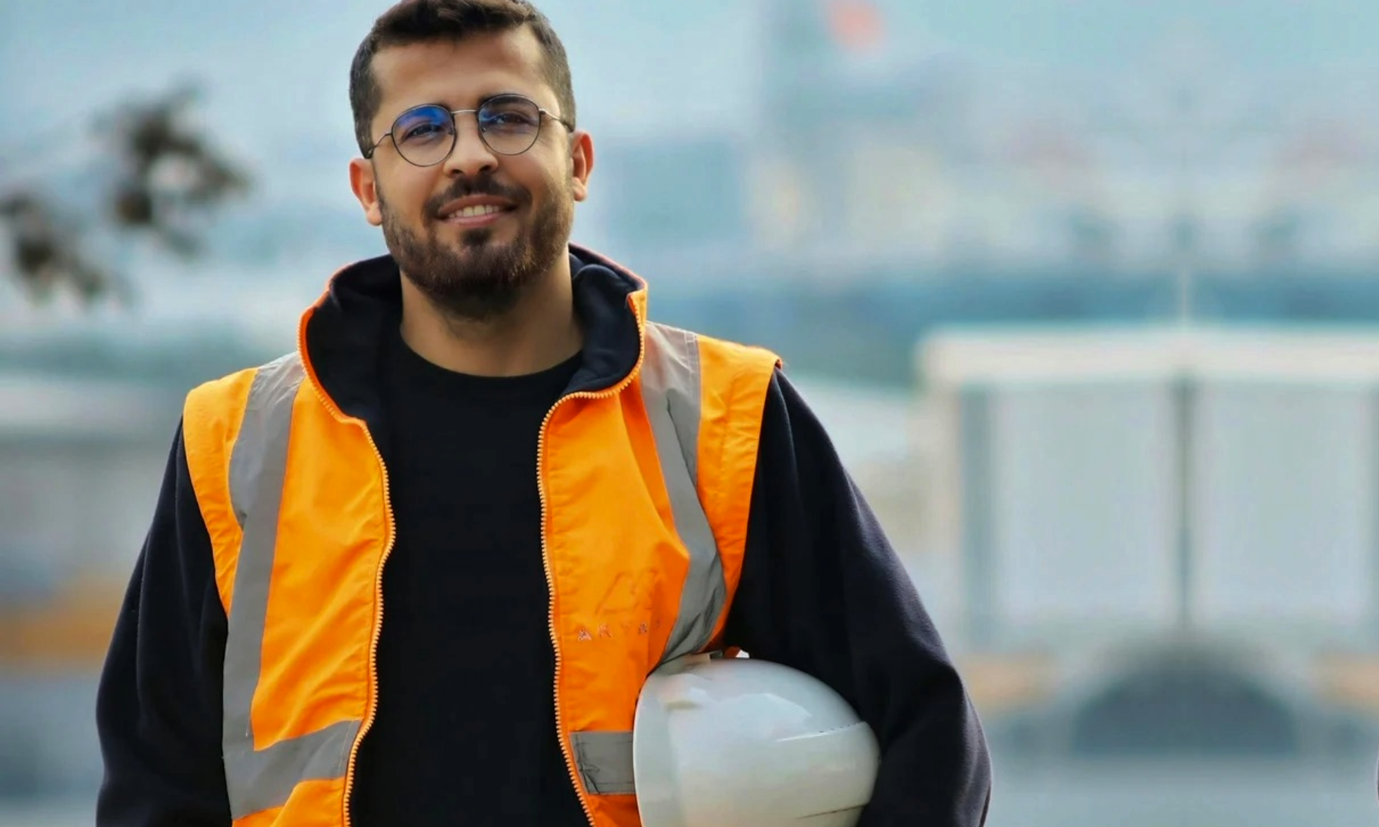 Male worker beard with orange vest